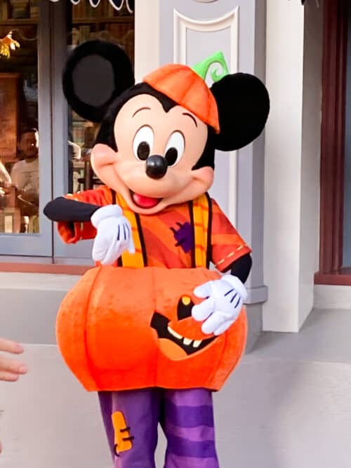 Mickey dressed as a pumpkin